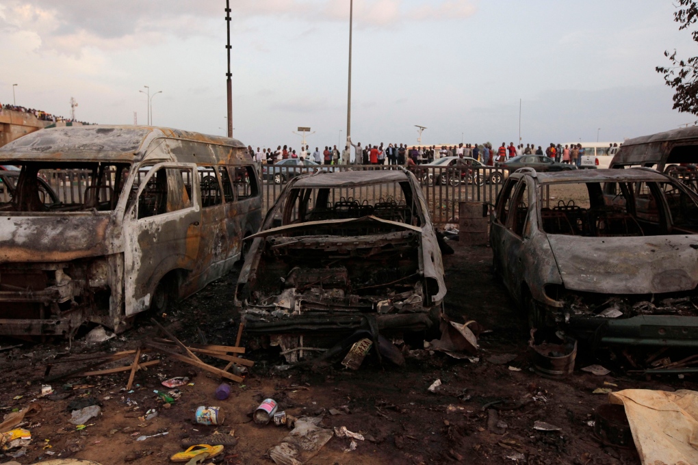 Damaged cars after blast at Nigeria bus station