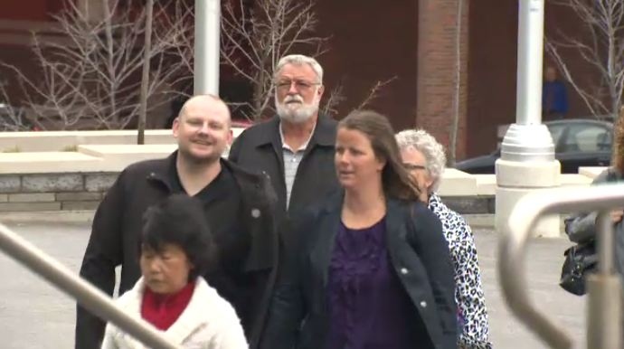 Flanked by supporters, Jacqueline Lavigne is seen walking into the Kitchener courthouse on Monday, April 14, 2014.