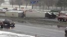 A tractor-trailer rolls over causing massive traffic delays on Highway 427 in Toronto, Tuesday, April 15, 2014. 