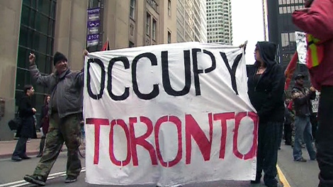 Occupy Toronto protesters marched to City Hall where they held a rally, Saturday, Oct. 22, 2011.