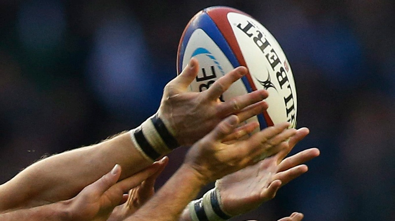 Players battle for a rugby ball
