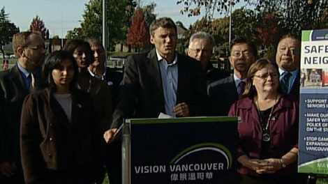 Vancouver Mayor Gregor Robertson speaks to reporters on Sunday, Oct. 23, 2011 surrounded by Vision Vancouver municipal election candidates. (CTV)