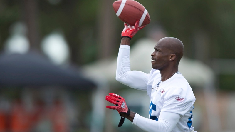 Former NFL wide receiver Chad Johnson throws the b