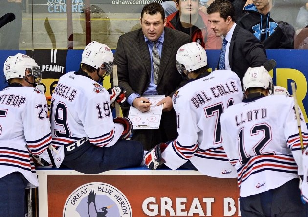 D.J. Smith, center, can be seen speaking with Oshawa Generals players in this undated photo. (Terry Wilson/ OHL Images)