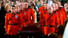The casket of Jim Flaherty is carried out by RCMP pallbearers at St. James Cathedral in Toronto, Wednesday, April 16, 2014.