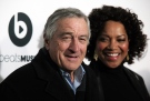 Tribeca Film Festival co-founder and actor Robert De Niro, left, with his wife Grace Hightower, attends the world premiere of "Time Is Illmatic" at the 2014 Tribeca Film Festival on Wednesday, April 16, 2014, in New York. (Photo by Andy Kropa/Invision/AP)