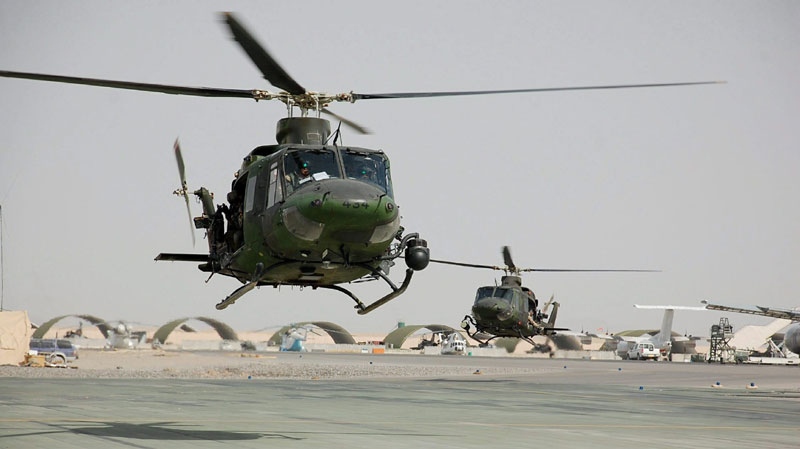 Two CH-146 Griffon helicopters are seen landing at Kandahar Airfield on Feb. 20, 2009