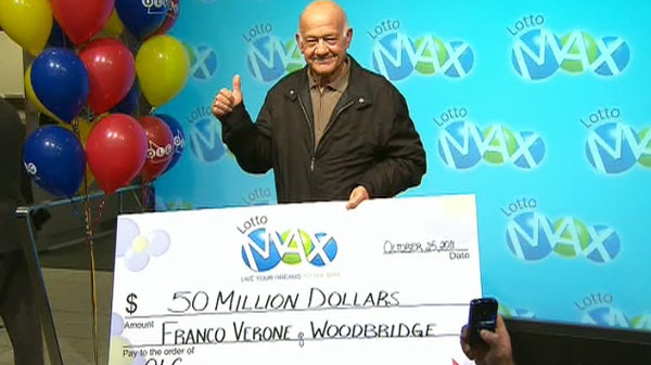 The winner of the $50 million Lotto Max grand prize accepts his prize on Tuesday, Oct. 25, 2011.