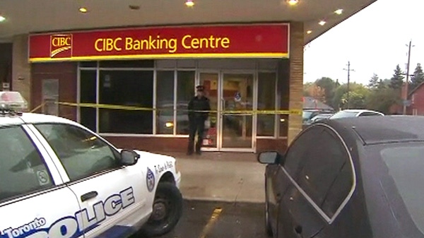 Police investigate after two suspects entered a CIBC at 1500 Islington Ave. near Rathburn Road in Etobicoke and left with a quantity of money on Wednesday, Oct. 26, 2011.