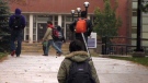 Students walk on the campus of Wilfrid Laurier University in Waterloo, Ont. on Wednesday, Oct. 26, 2011.