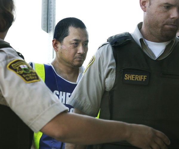 Vince Li, the accused in the Greyhound bus beheading of Tim McLean appears in a Portage La Prairie court on Tuesday, August 5, 2008. (John Woods / THE CANADIAN PRESS)