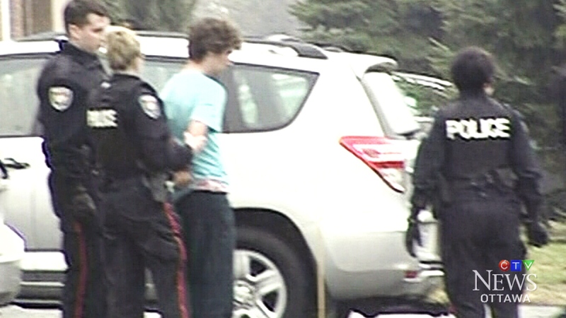 18-year-old Christopher Gobin is taken into custody on April 22, 2014. He has been charged with first degree murder in the stabbing death of his mother Luce Lavertu.