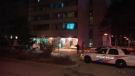 Police investigate a shooting inside an apartment building in Toronto on Tuesday, April 22, 2014. 