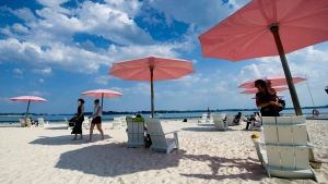 People take in the sun at Sugar Beach in Toronto on Wednesday, July 4, 2012. (Nathan Denette / THE CANADIAN PRESS)  