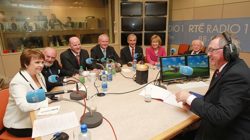 Ireland's RTE radio presenter Sean O'Rourke, right, faces Irish Presidential candidates, from second right, Michael D Higgins, Mary Davis, Gay Mitchell, Martin McGuinness, Sean Gallagher, David Norris and Dana Rosemary Scallon for a News at One radio debate, in Dublin, Ireland, Wednesday Sept. 28, 2011. 