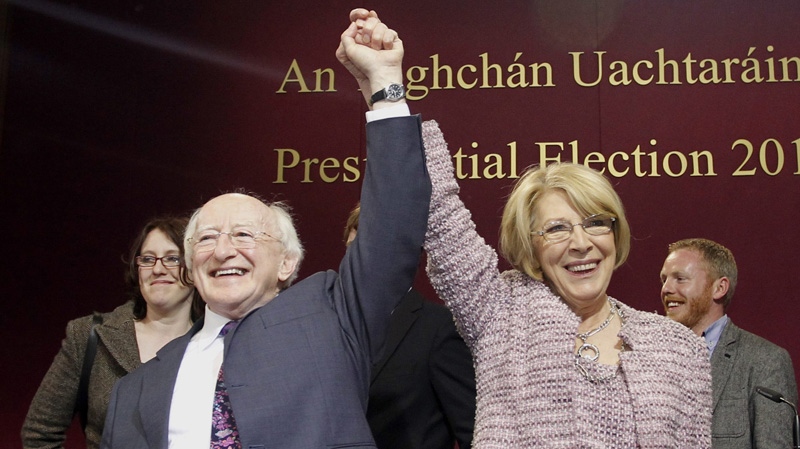 Michael D Higgins, left, and his wife Sabina react after he won in the first count in the election to be next President of Ireland at Dublin Castle, Ireland, Friday, Oct. 28, 2011. (AP Photo/Peter Morrison)