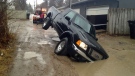 A truck was nearly swallowed by a sinkhole Wednesday in a back alley on Lorne Avenue. (photo: Robyn Chatlain)