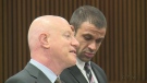 Windsor police constable, David Bshouty, right, and lawyer Harold Fried, left, speak at a preliminary examination at the Frank Murphy Hall of Justice in Detroit, Mich. on Friday, April 25, 2014. (CTV Windsor) 