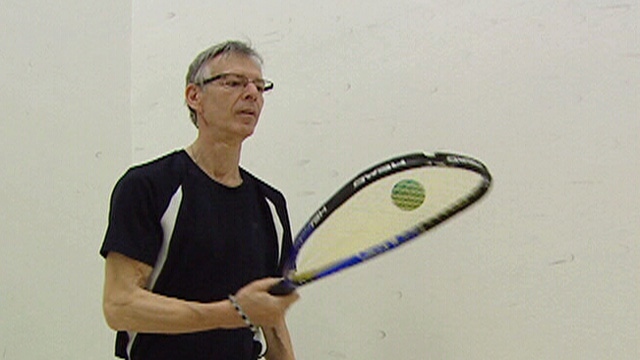 Jacques Seguin gets ready for a racquetball game.