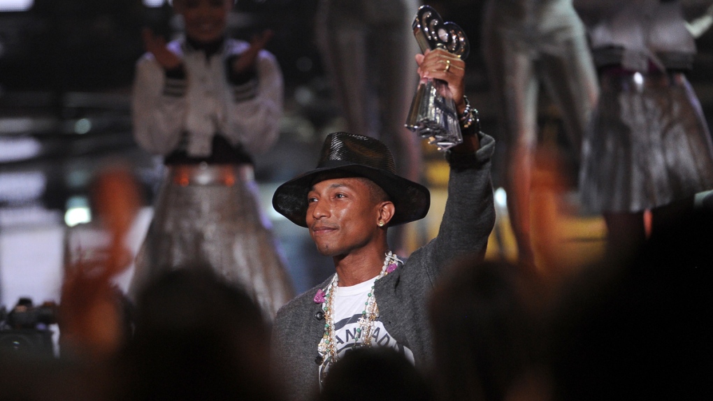 Pharrell Williams accepts an iHeartRadio award