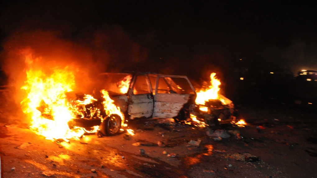 Car burns after explosion in Abuja, Nigeria