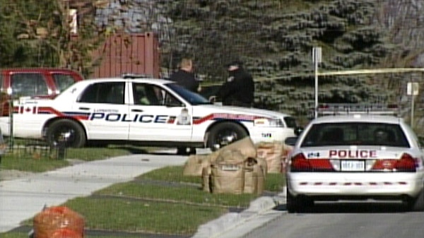 Cruisers sit at the scene of a shooting in London, Ont. on Sunday, Nov. 6, 2011.