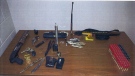 A photo provided by the Hanover Police Service shows a sawed-off shotgun, two 32 calibre revolvers, switchblades, brass knuckles, a stiletto knife, ammunition, an expandable baton, break and enter tools and a recording device seized at an area hotel on April 28, 2014.
