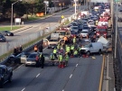 Emergency personnel attend to victims of a crash in the QEW's eastbound lanes Sunday, May 4, 2014. (Photo courtesy of Manny Cordeiro)