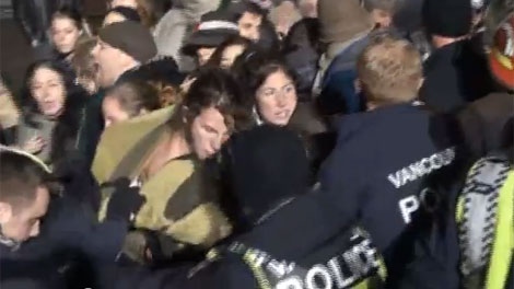 Protesters and police shove each other at the Occupy Vancouver encampment. Nov. 8, 2011. (YouTube)