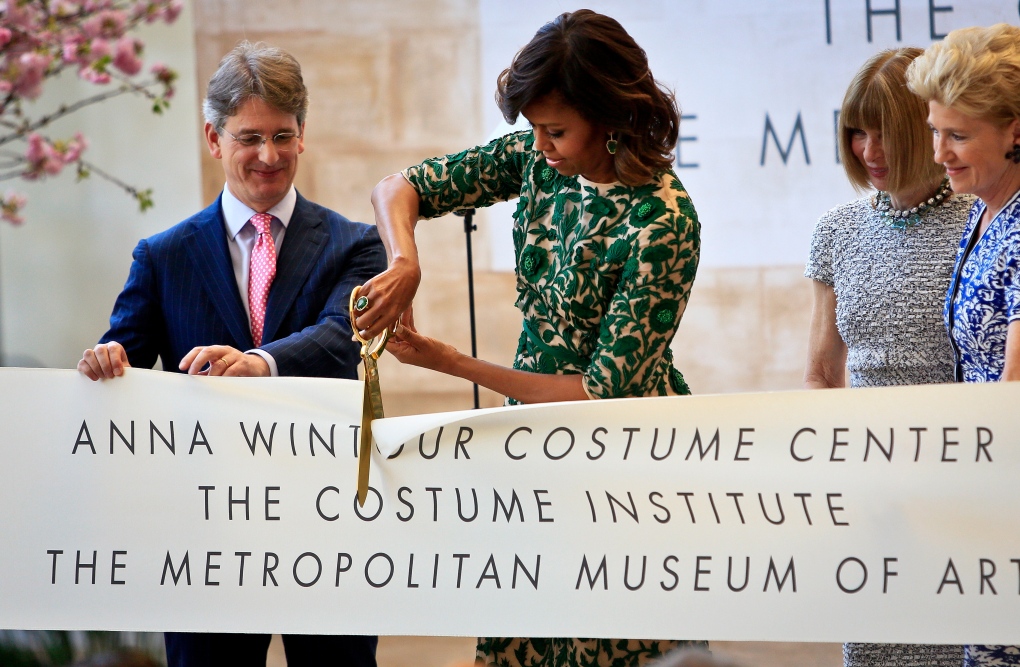 Michelle Obama cuts the ribbon.