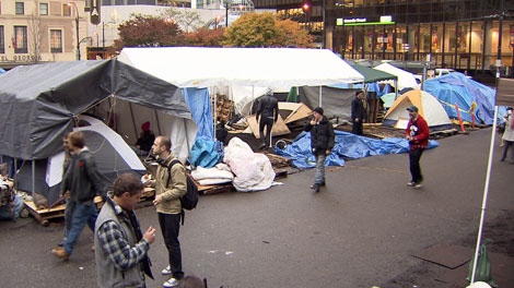 Occupy Vancouver protesters clear out tarps and other fire hazards to comply with a court order. Nov. 9, 2011. (CTV)