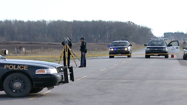 OPP examine the scene of a double fatal crash in Norwich Township, Ont. on Tuesday, Nov. 8, 2011.