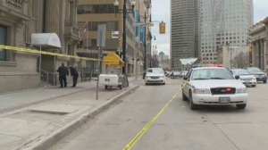 Police investigate on Main Street near Bannatyne after a fatal shooting outside the Opera Ultralounge on May 4, 2014 in Winnipeg, Man.