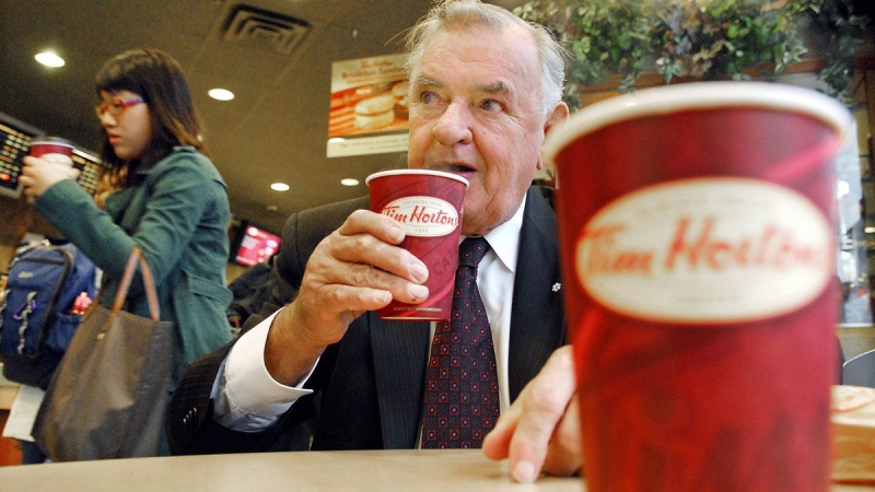 Tim Hortons co-founder Ron Joyce sips a coffee in Toronto on Friday, October 20, 2006. (File / THE CANADIAN PRESS)