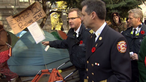 Vancouver Fire Chief John McKearney tours the Occupy Vancouver tent city. Nov. 10, 2011. (CTV)