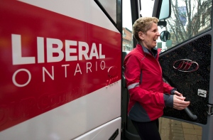 Ontario Premier Kathleen Wynne smiles as she gets off her bus at a campaign event in Milton, Ontario on Monday May 5, 2014. THE CANADIAN PRESS/Frank Gunn
