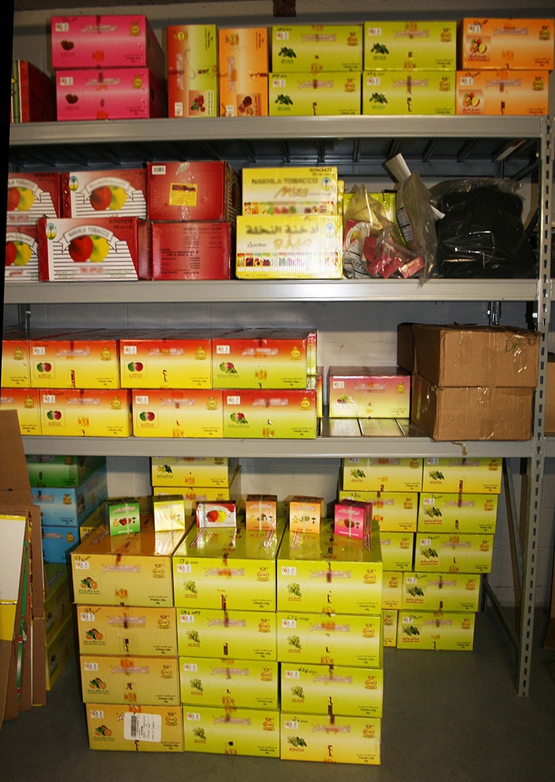 Canada Border Services Agency (CBSA) officers seized 115 cases of shisha tobacco and $67,665 in cash after executing search warrants on May 1, 2014.