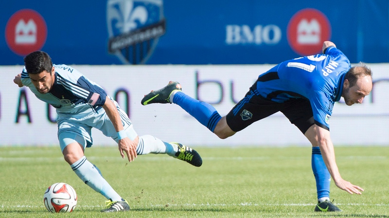 Montreal Impact's Justin Mapp, right, an Sporting 