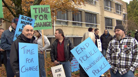 About 100 demonstrators stood outside RCMP headquarters in Vancouver demanding police be held responsible when they invoke deadly force. Nov. 13, 2011. (CTV)