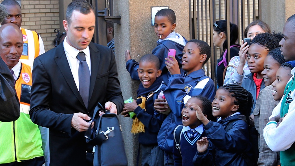 Children react as Oscar Pistorius leaves court