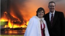 Mike and Nancy Rogers pose for wedding photographer Nicholas Augustus as White Point Beach Resort's main lodge burns in the background on Saturday Nov. 12, 2011. (THE CANADIAN PRESS/Nicholas Augustus)