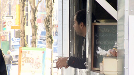 Mark Cohen waits for customers at the Mangal Kiss Mideast BBQ cart in downtown Vancouver. Nov. 15, 2011. (CTV)