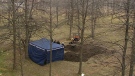 Police search Heatherington Road park in connection with human remains found nearby on Wednesday, Nov. 16, 2011.