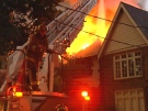 Firefighters battle the blaze in Forest Hill in Toronto early Monday, Aug. 11, 2008.