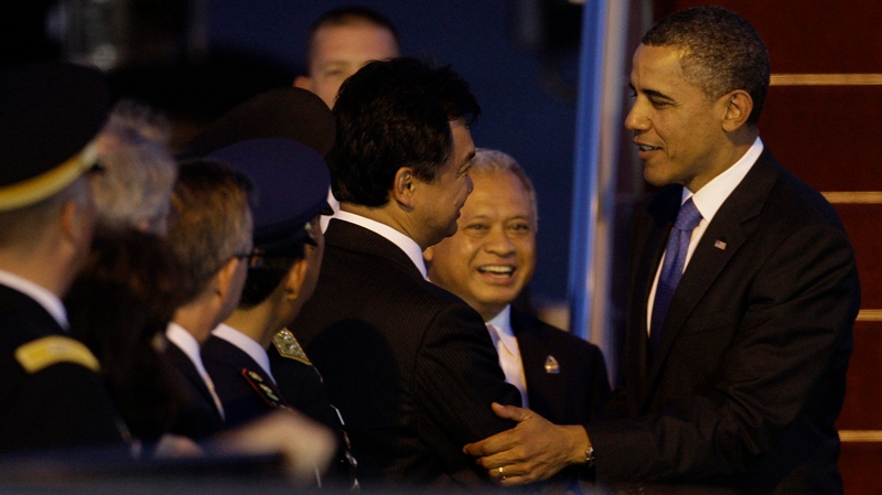 U.S. President Barack Obama, right, is greeted by Indonesian Ambassador to the United States Dino Patti Djalal as he arrives at Denpasar International Airport to attend the ASEAN and East Asia Summit in Denpasar, on the island of Bali, Indonesia, Thursday, Nov. 17, 2011. 