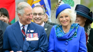 Prince Charles and his wife Camilla smile during an event in Halifax on Monday, May 19, 2014. (The Canadian Press/Paul Chiasson)