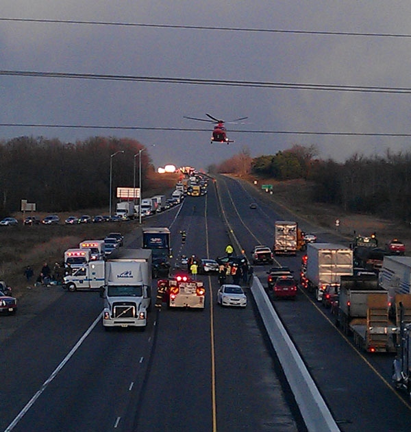 An air ambulance is seen hovering over the scene of a major accident on Highway 401 neat Trenton Thursday, Nov. 17, 2011.