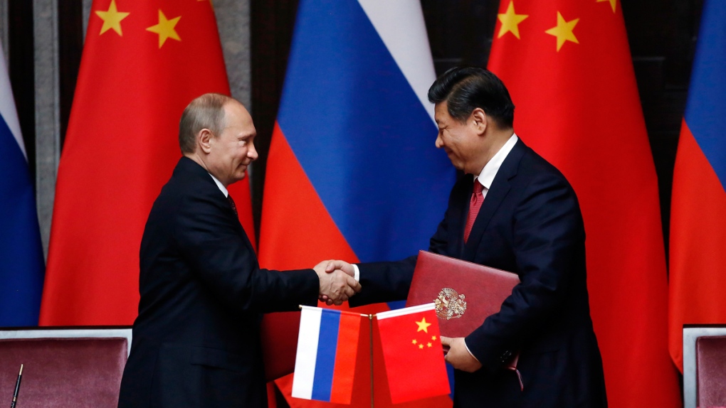 Vladimir Putin, Xi Jinping shake hands in Shanghai