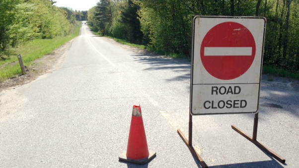 A road closed sign is seen in Mulmur May 24, 2014 as police investigate a serious motorcycle crash. (Don Wright / CTV Barrie)