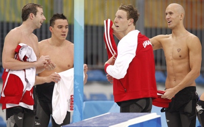 Canada's Rick Say, Joel Greenshields, Colin Russell, and Brent Hayden, left to right, chat following the men's 4x100-metre final at the Beijing 2008 Summer Olympics in Beijing, Monday, August 11, 2008. (Paul Chiasson / THE CANADIAN PRESS)